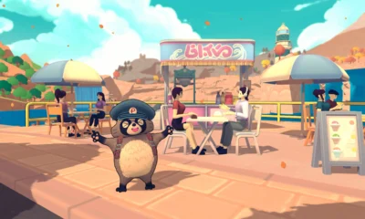 Pon in his postal cap at a seaside cafe in TANUKI: Pon's Summer